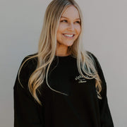 black crewneck with white written sorority name in script